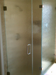 Frameless shower enclosures